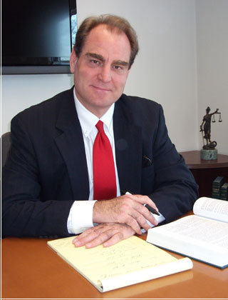 R. Paul Kuhn, Esq. at his desk
